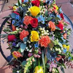 Seasonal Rainbow Casket Spray